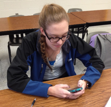 Junior Eileen Tracy used her phone to message a friend on Facebook, asking what that day’s math homework was.  Having the mobile app makes it that much easier for someone to stay in touch with a friend they can’t always see or talk to.  