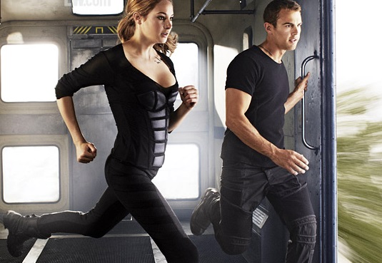 Divergent leads Shailene Woodley and Theo James run during one of the many  action scenes of Divergent.  The film hit theaters March 21, 2014.