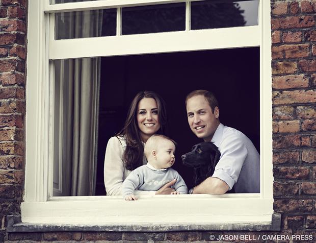 Duke and Duchess of Cambridge and Prince George posing for their most recent family portrait.
