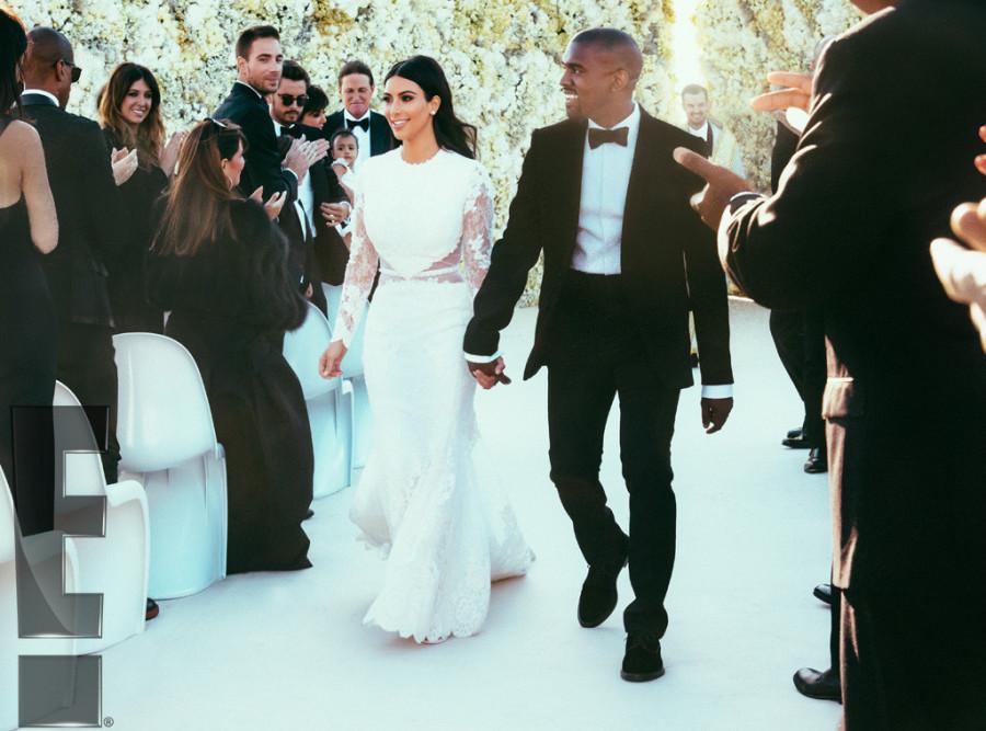 Newlyweds+Kim+Kardashian+and+Kanye+West+walk+down+the+aisle+after+saying+their+vows.+The+couple+filmed+their+wedding+for+an+E%21+special+premiering+later+this+year.