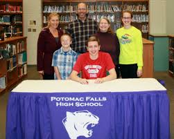 Senior Justin Touve signs his letter of intent to the Fairfield Stags. Touve and Carlton both committed to Division I colleges this November. 