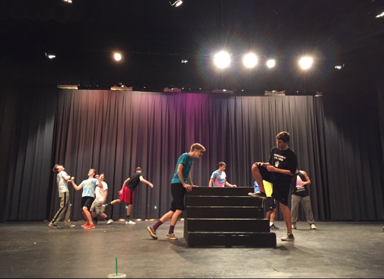 The boys are preparing for their show by practicing with the props. Photo taken by senior class sponsor, Martha Ryman