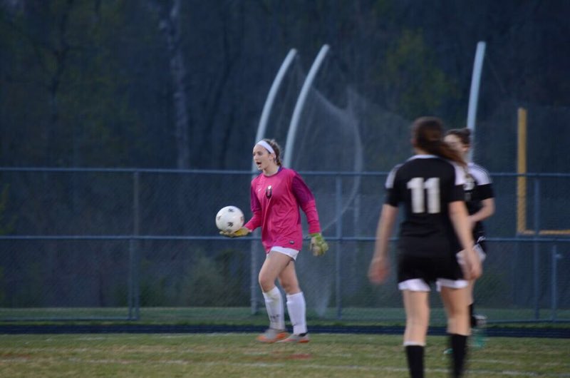 Jessica+Touve%2C+in+the+pink+goalie+shirt%2C+throws+the+ball+back+into+the+game.+She+is+captain+have+her+soccer+team%2C+which+displays+a+lot+of+leadership+in+Touve.