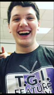 Jack Taylor poses for a picture to show off his Feature Friday shirt. He loves being involved in school activities. 