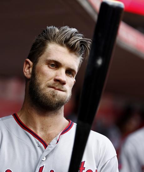 May 29, 2015; Cincinnati, OH, USA; Washington Nationals right fielder Bryce Harper prepares in the dugout at the beginning of a game with the Cincinnati Reds at Great American Ball Park. Mandatory Credit: David Kohl-USA TODAY Sports