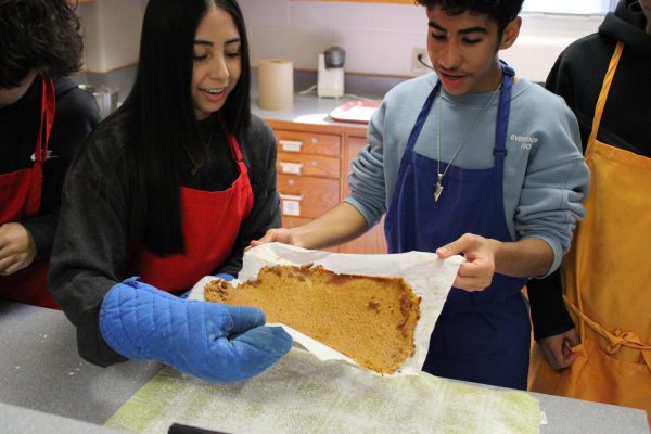 Gourmet Foods students baking a cake in class. 
