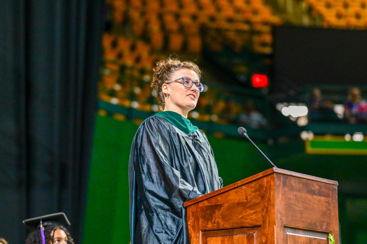 Social sciences teacher Kristin Bird addresses the class of 2025 at their commencement ceremony
